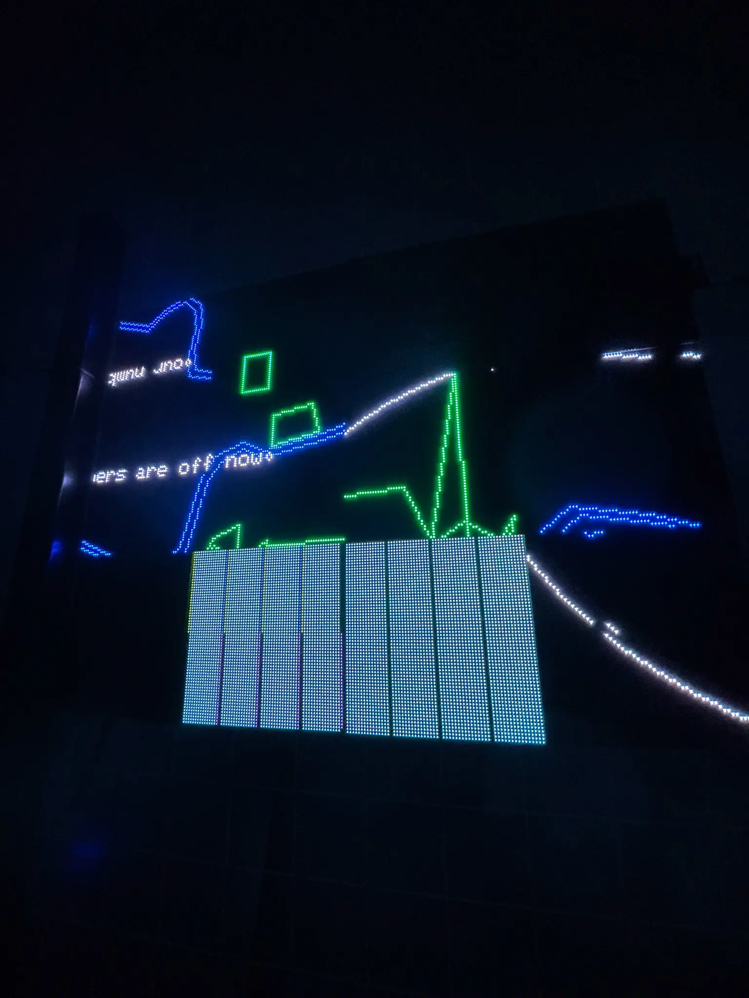 Glitched Led Panels showing poem fragments