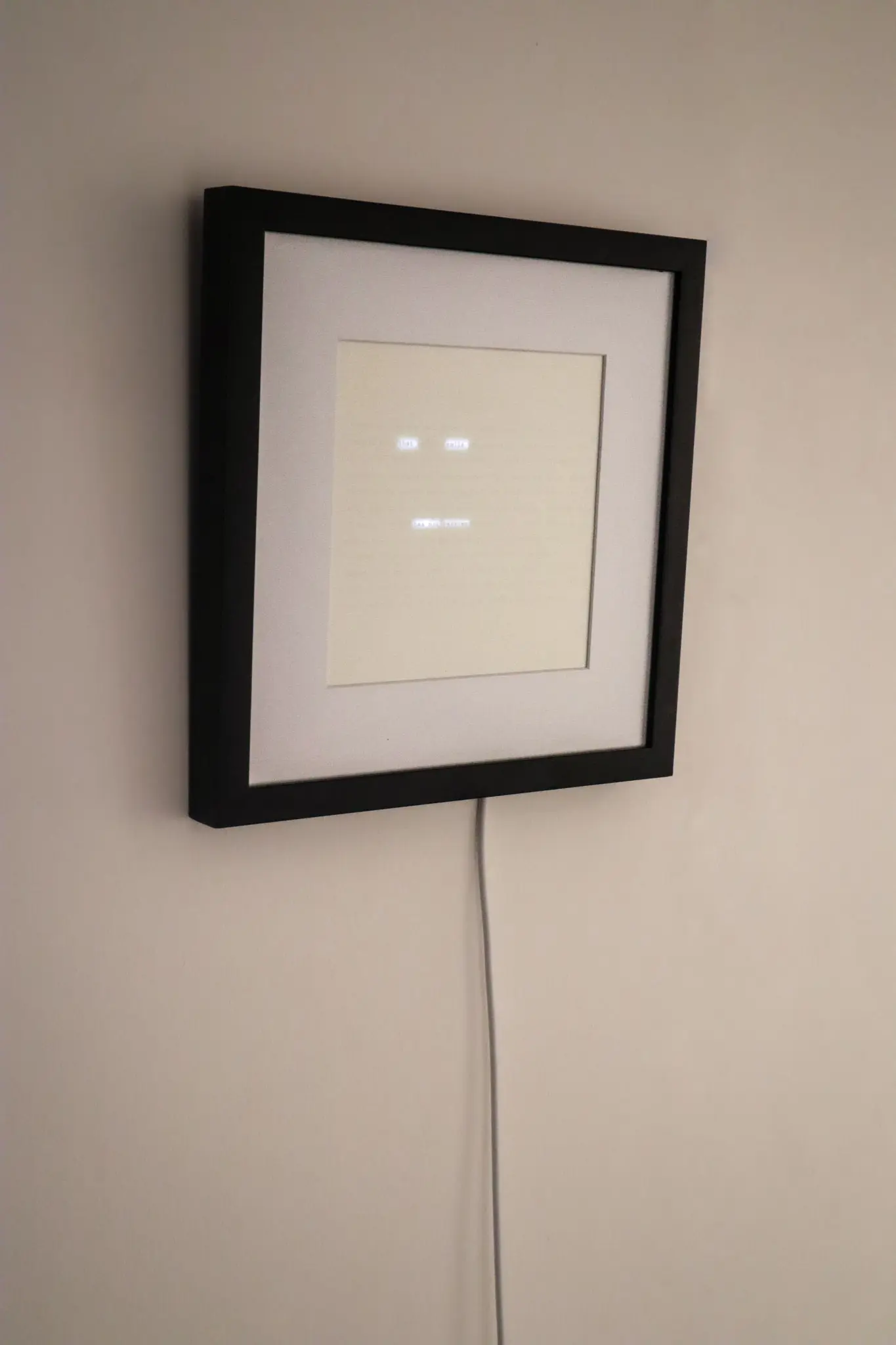 Paper poem lit from behind showing partial words