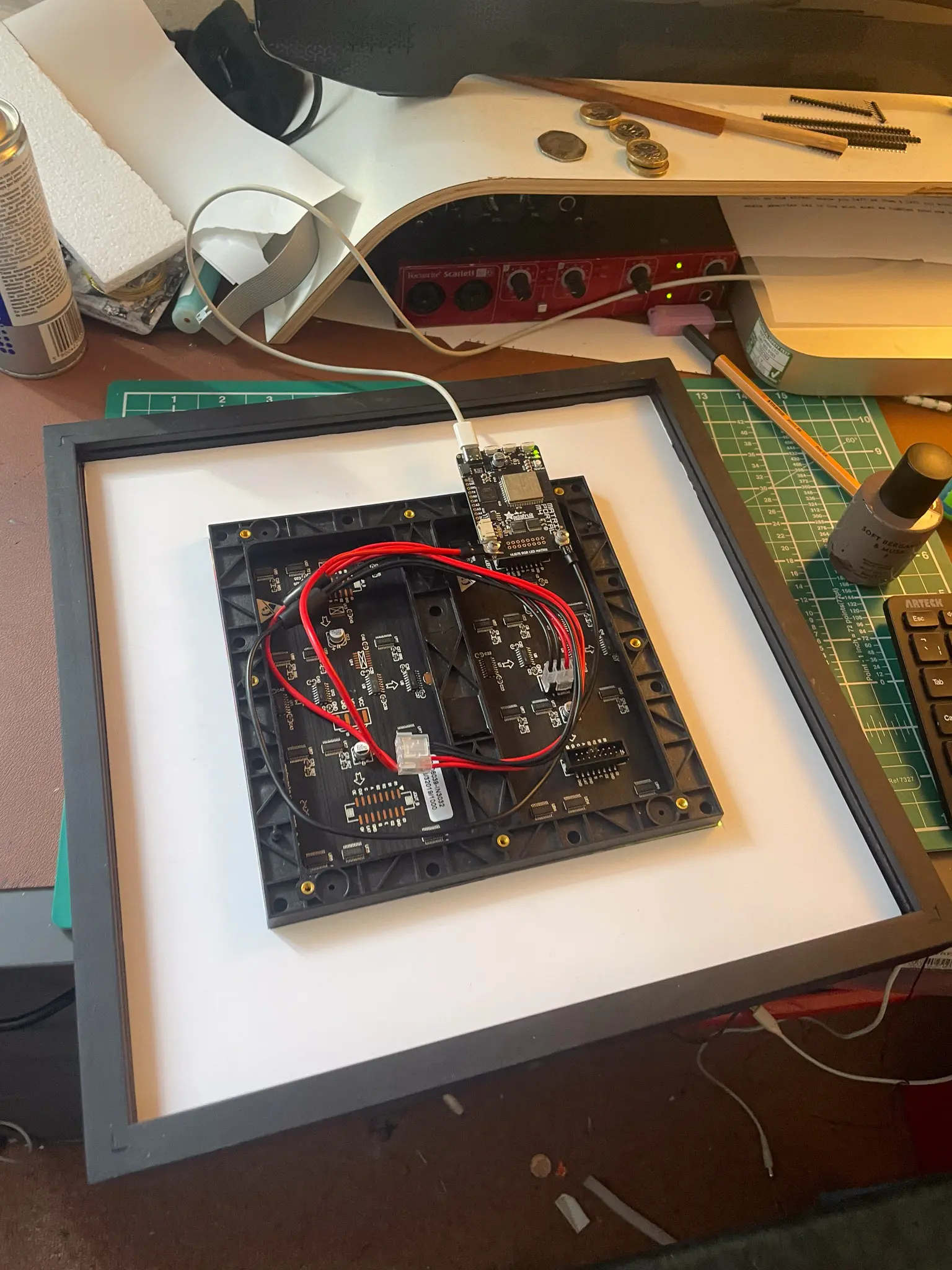 Paper poem lit from behind showing partial words