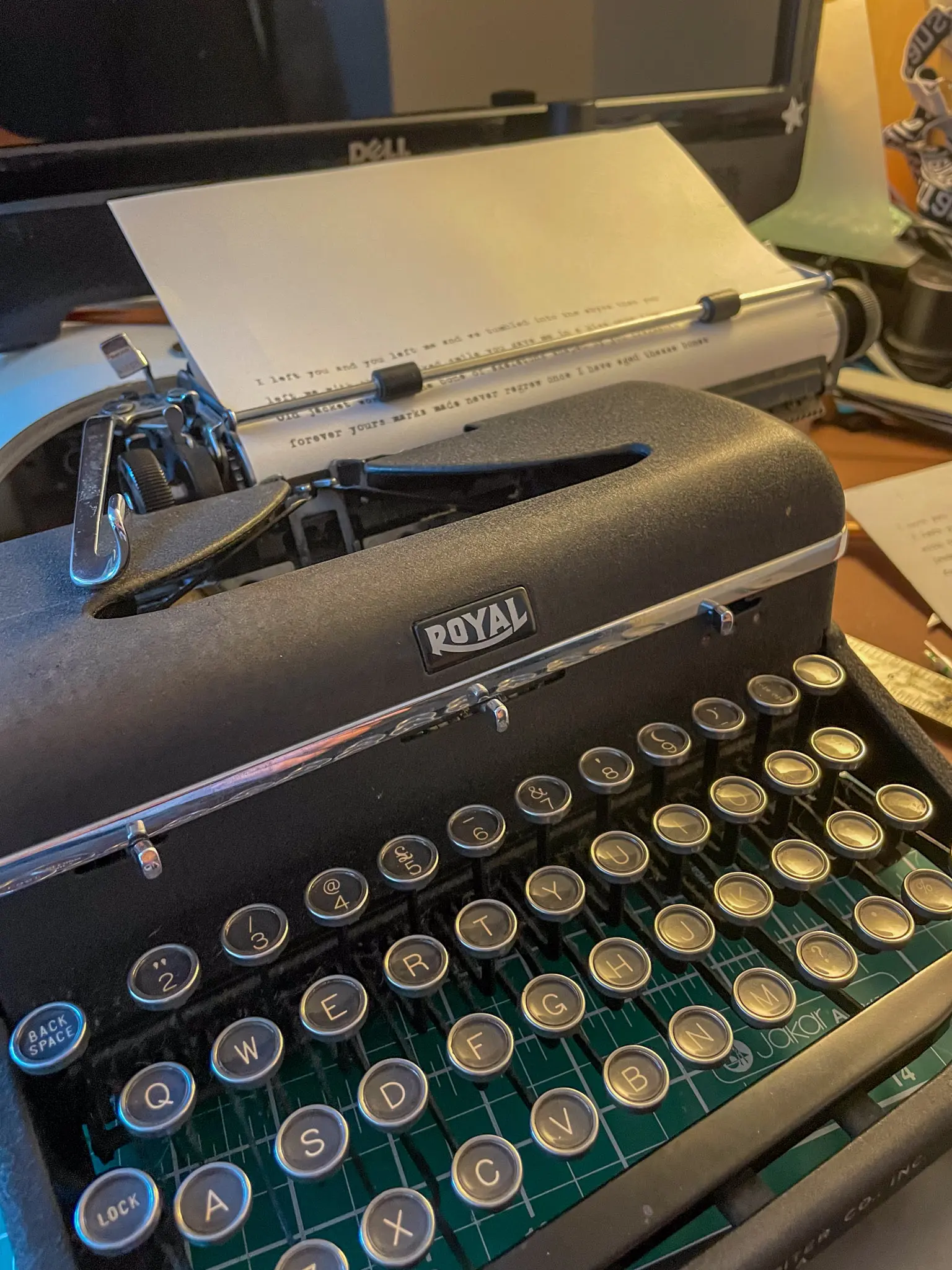 Paper poem lit from behind showing partial words