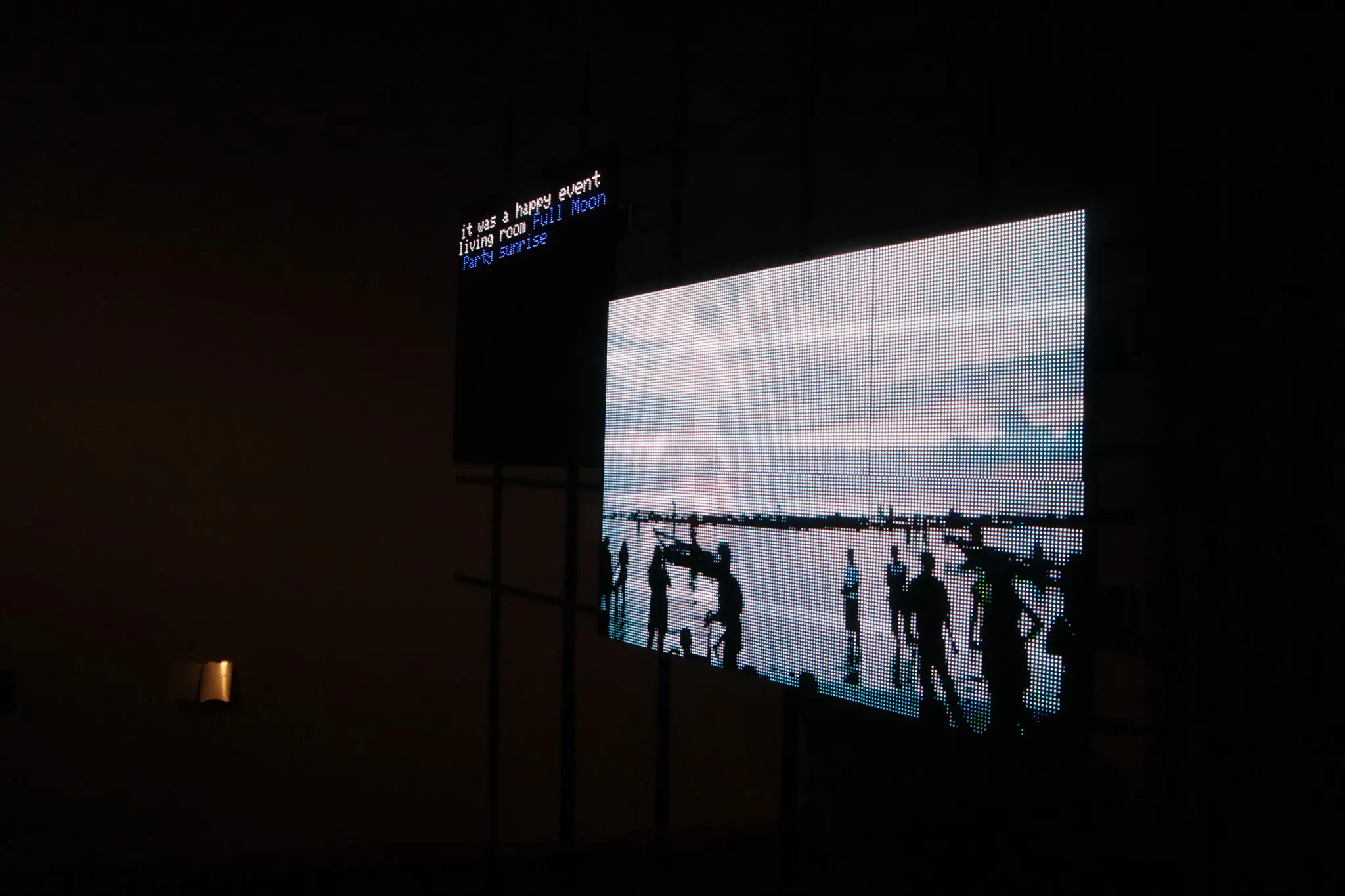 LED panels in a darkened room mid-animation