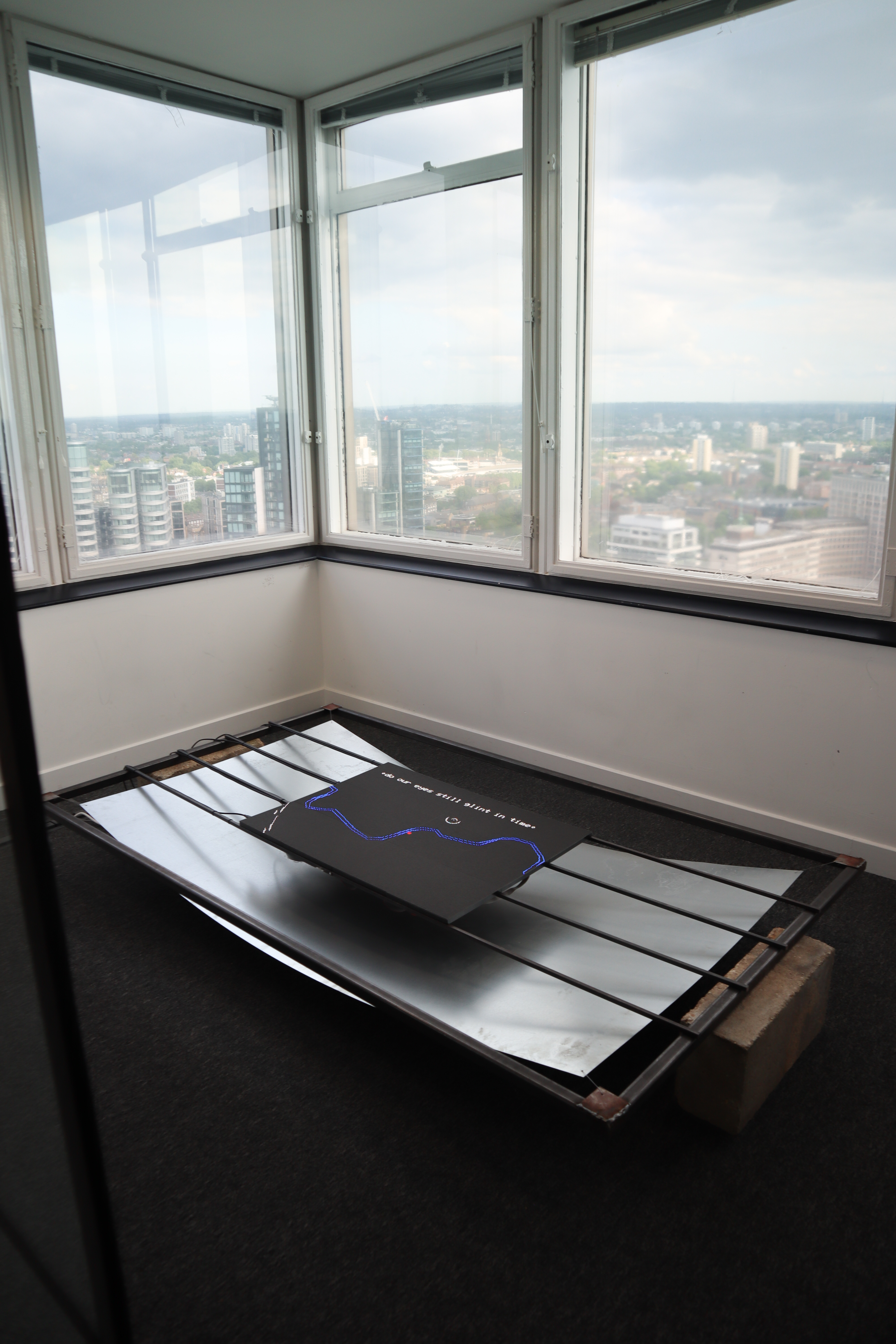 room with metal sheets and a LED panels littup